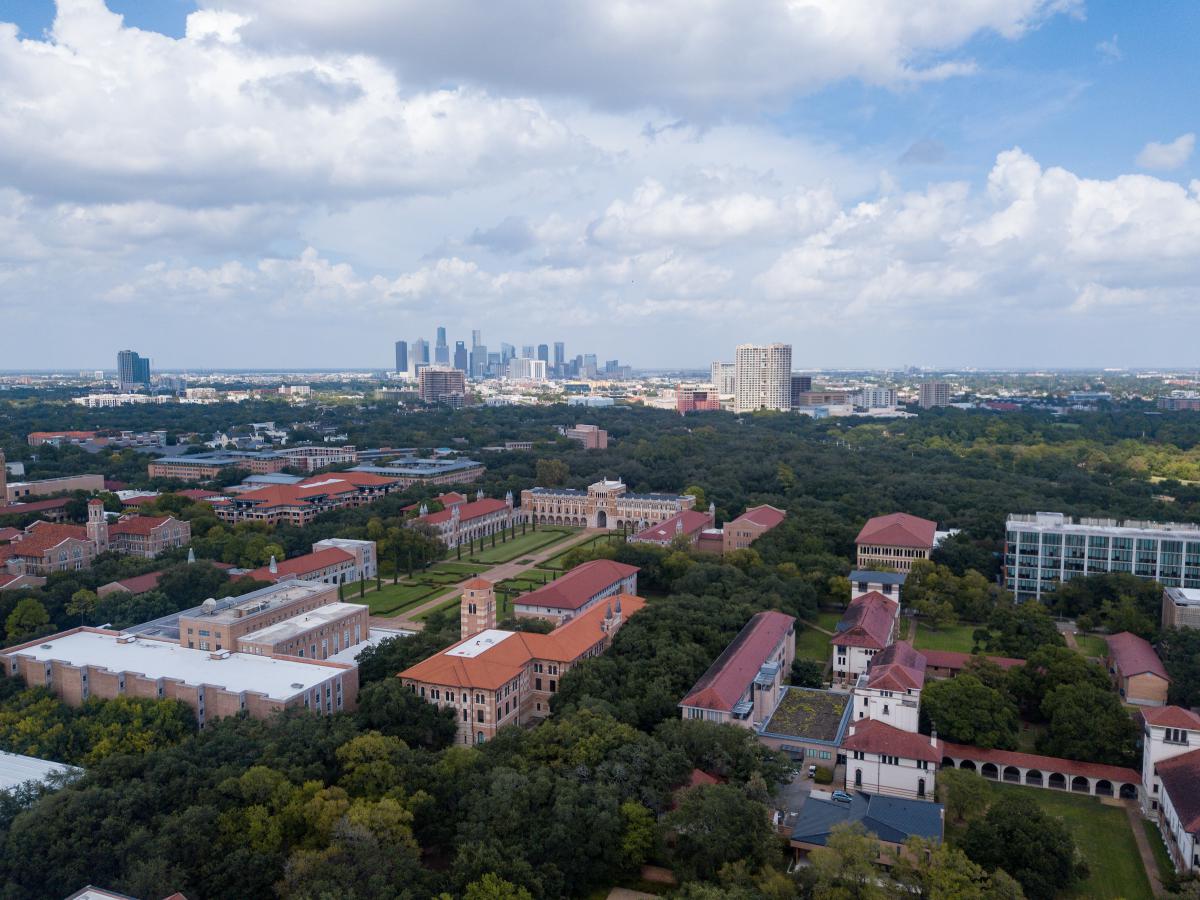 Aerial picture of the entire Rice campus with the Houston skyline in the background.