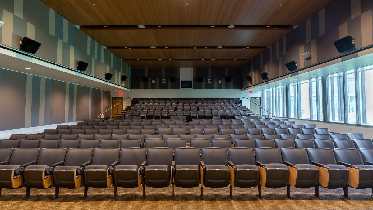 Picture taken from the front of an empty Hudspeth Auditorium showing all of the seats.