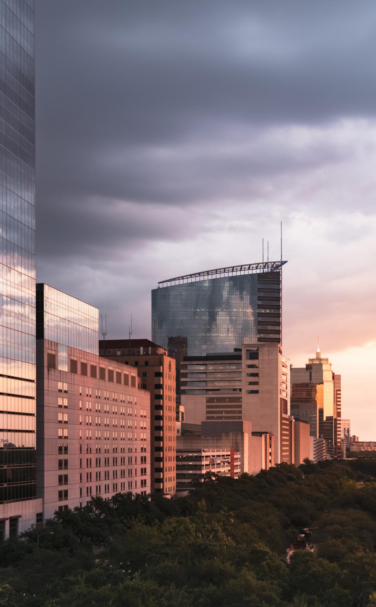Vertical picture of the buildings that are part of the Texas Medical Center at sunset.